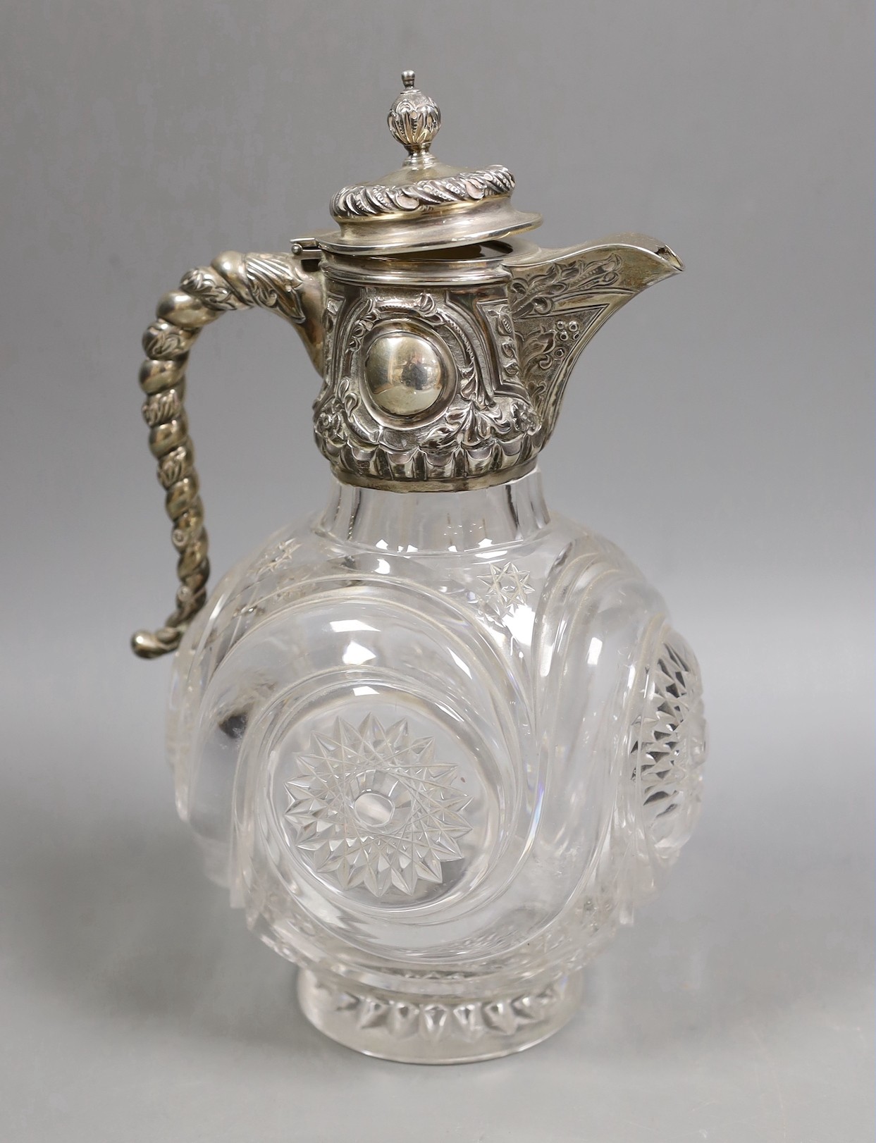 An Edwardian silver mounted cut glass claret jug, John Grinsell & Sons, Birmingham, 1902, 26cm.